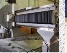Large-format CNC router cutting a flat sheet