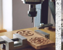 Small-format CNC router engraving a decorative pattern