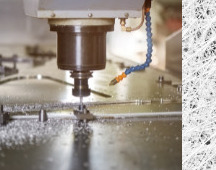 CNC spindle machining metal with coolant mist
