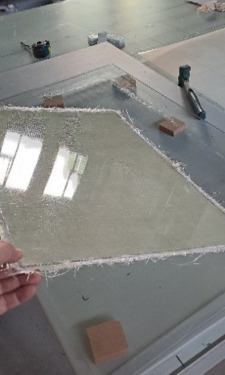Finished fibreglass panel lifted from the mould